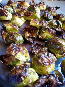 How To Bake Brussels Sprouts To Get Perfect Sprouts Every Time! Some baked sprouts on a baking trey.