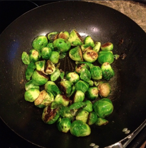 Best Brussel Sprout Recipe, a frying pan full of brussel sprouts.