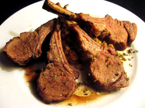 Lamb Health Benefits, cooked lamb chops on a white plate.